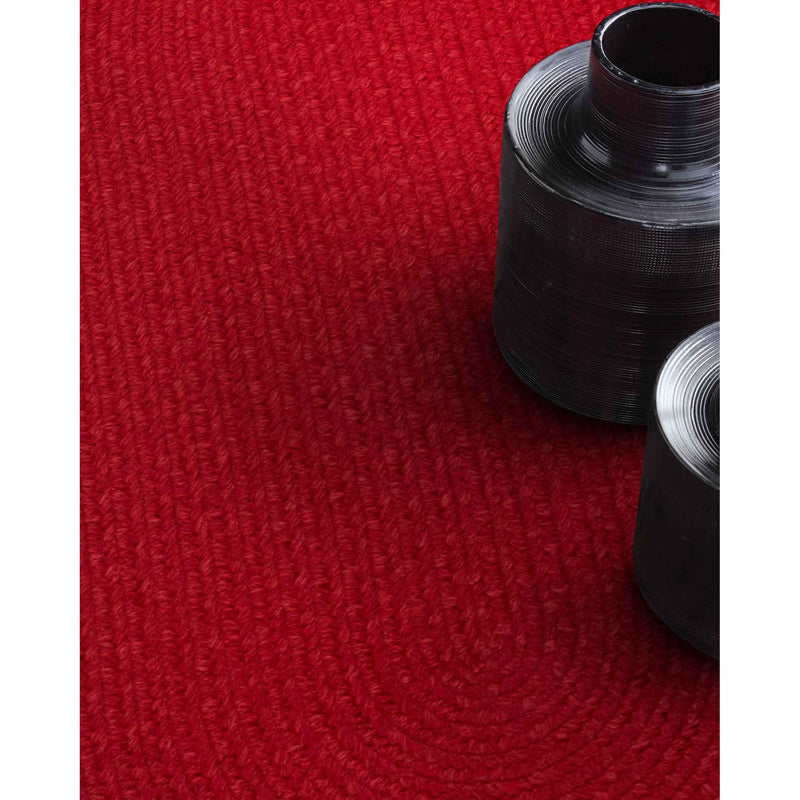 Heathered Scarlet Red Solid Braided Rug Oval Roomshot image